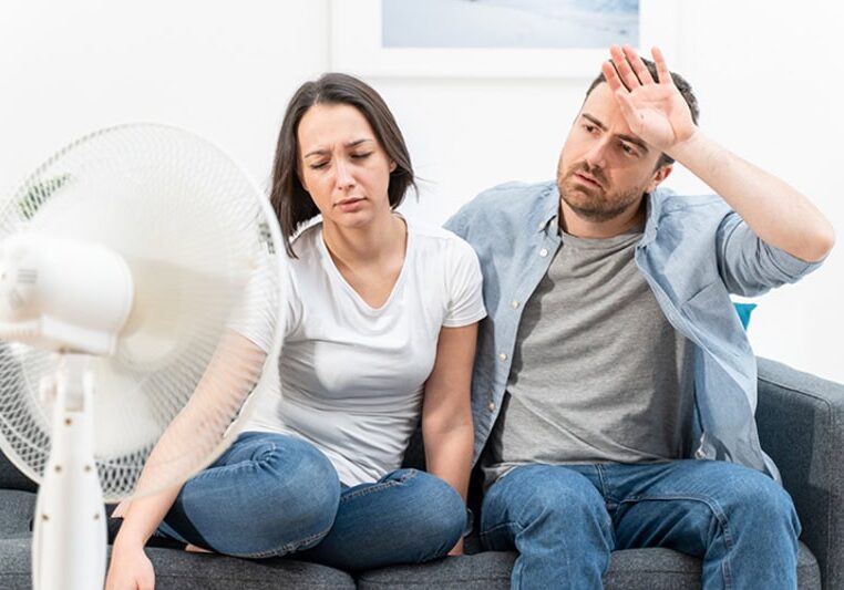 Couple trying to refresh during summer heat wave.