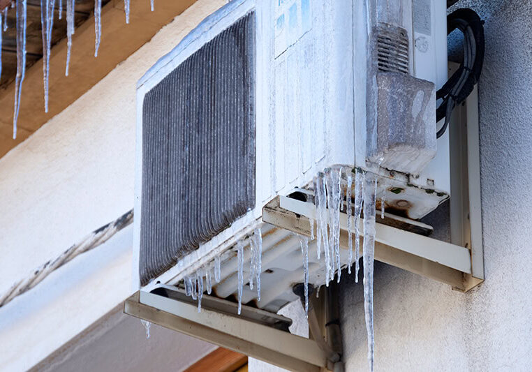 Why Is My Heat Pump Freezing Up? A heat pump covered in ice.